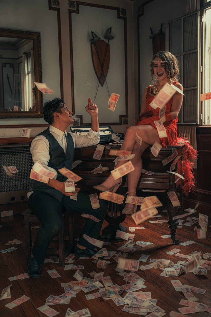 A 1920s style couple in a vintage room with money falling around them, symbolizing prosperity and luxury. [pexels]